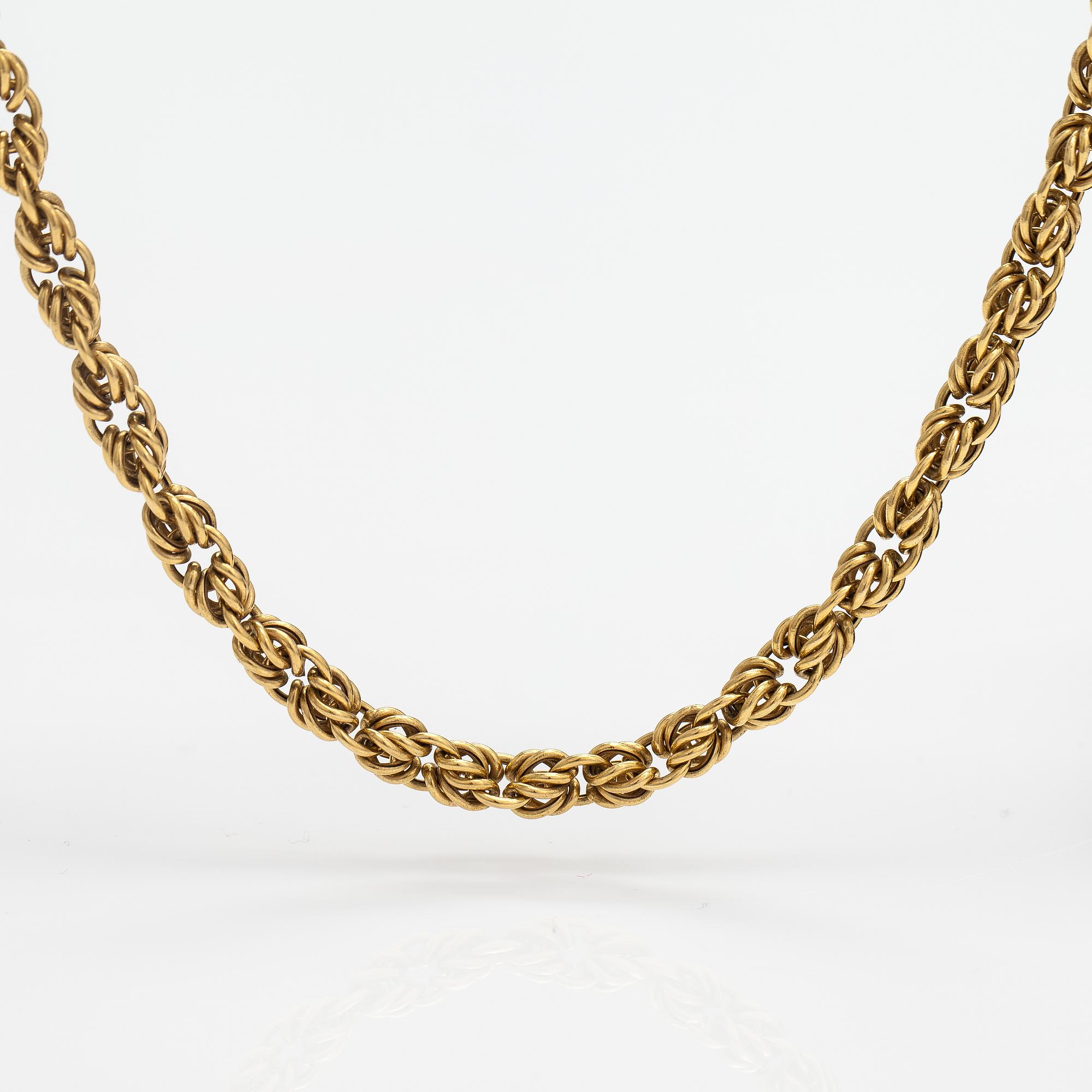 An 18K gold necklace. Unoaerre, Italy.
