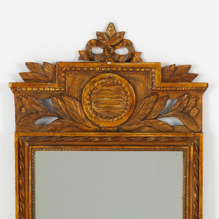 An Empire style mirror, around the year 1900.