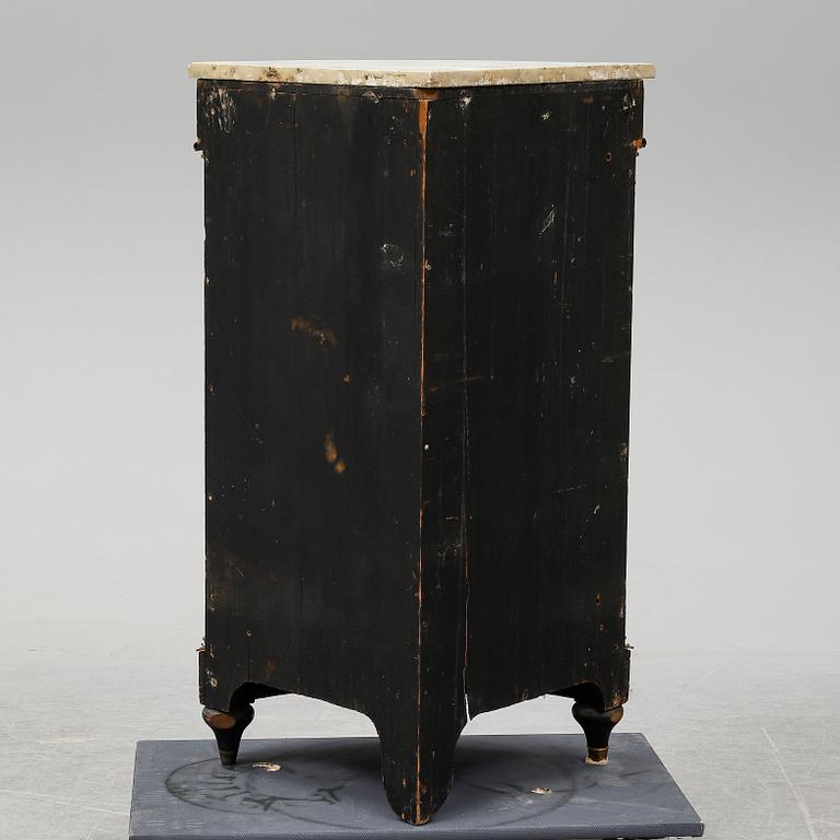 A 19th century corner cabinet.