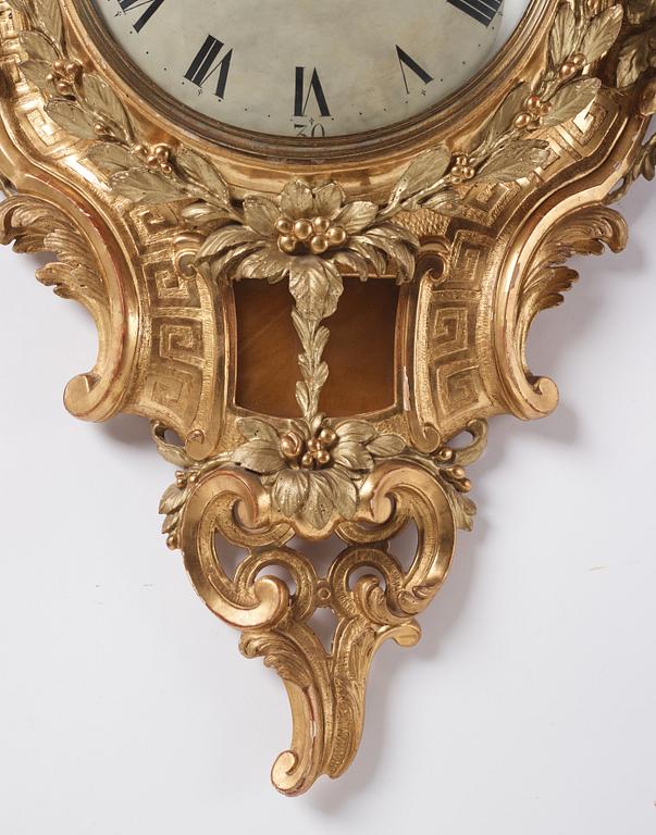 A rococo giltwood cartel clock by J. Lindgren (master in Stockholm 1761-62).