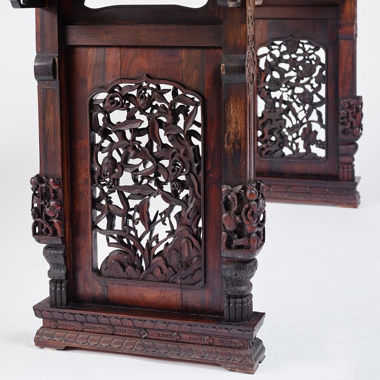 A massive zitan recessed-leg long table 'Jiaotousun Qiotouan', Qing dynasty, 19th century.