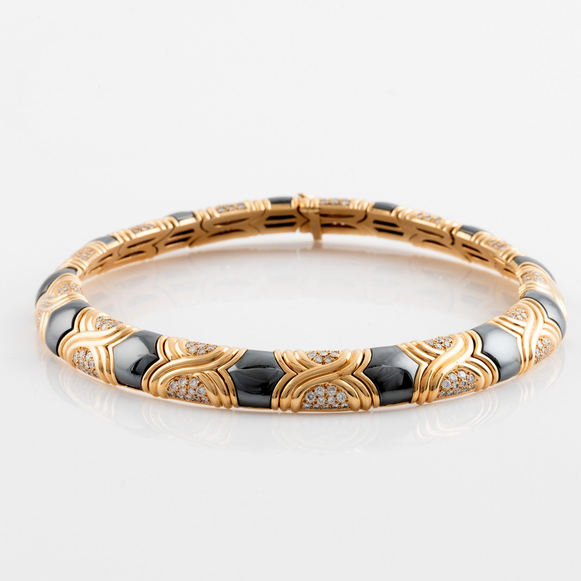 A Bulgari 18K gold and hematite necklace set with round brilliant-cut diamonds.