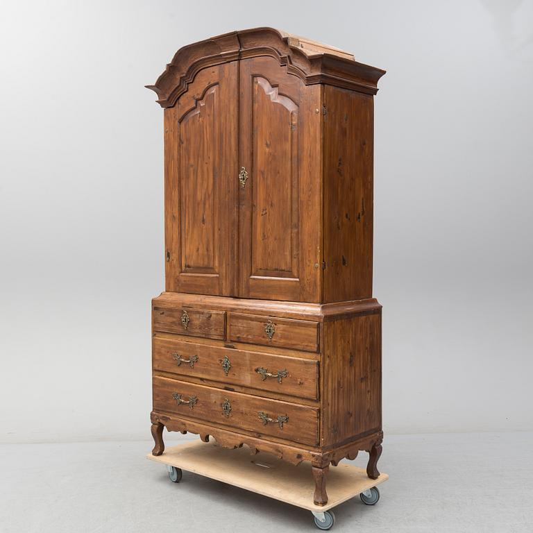 a 1700's Rococo pine cabinet.