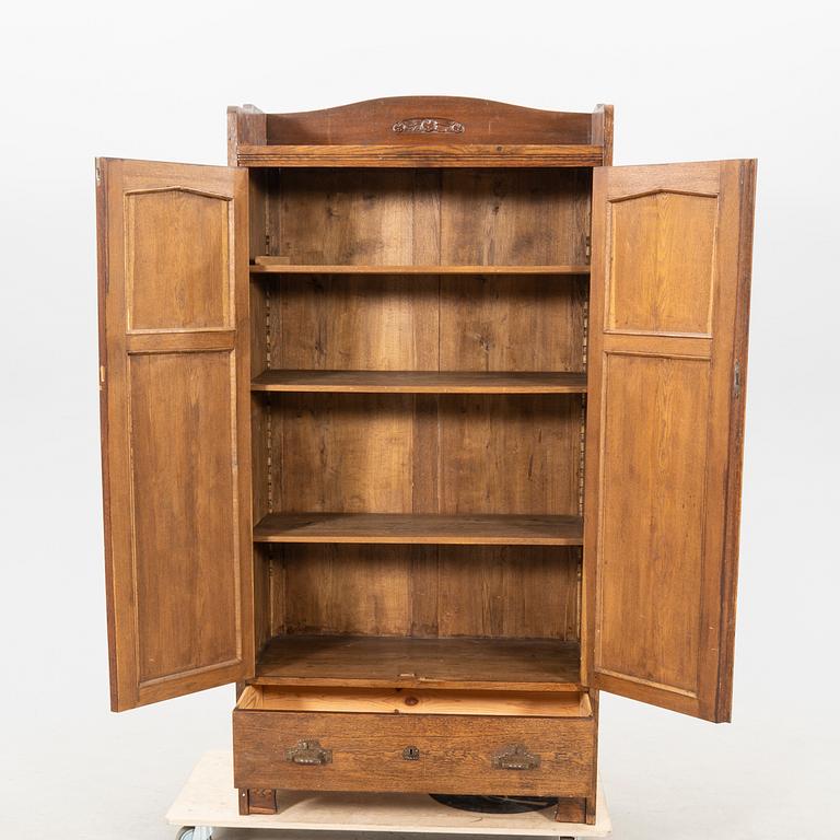 An early 1900s oak cabinet.