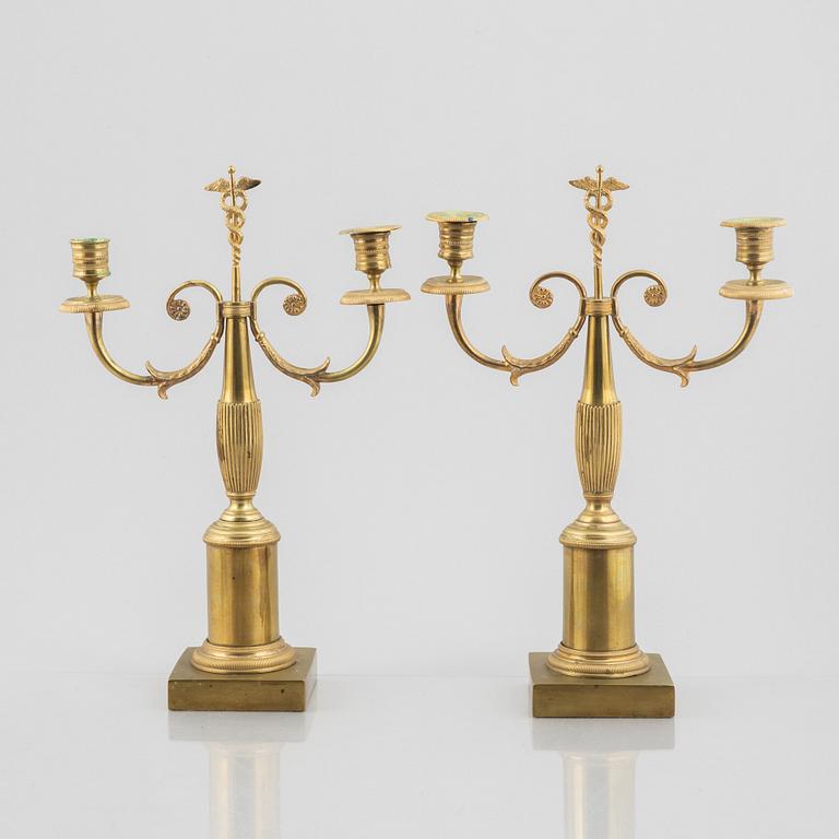 A pair of brass candelabra, first half/mid 19th century.