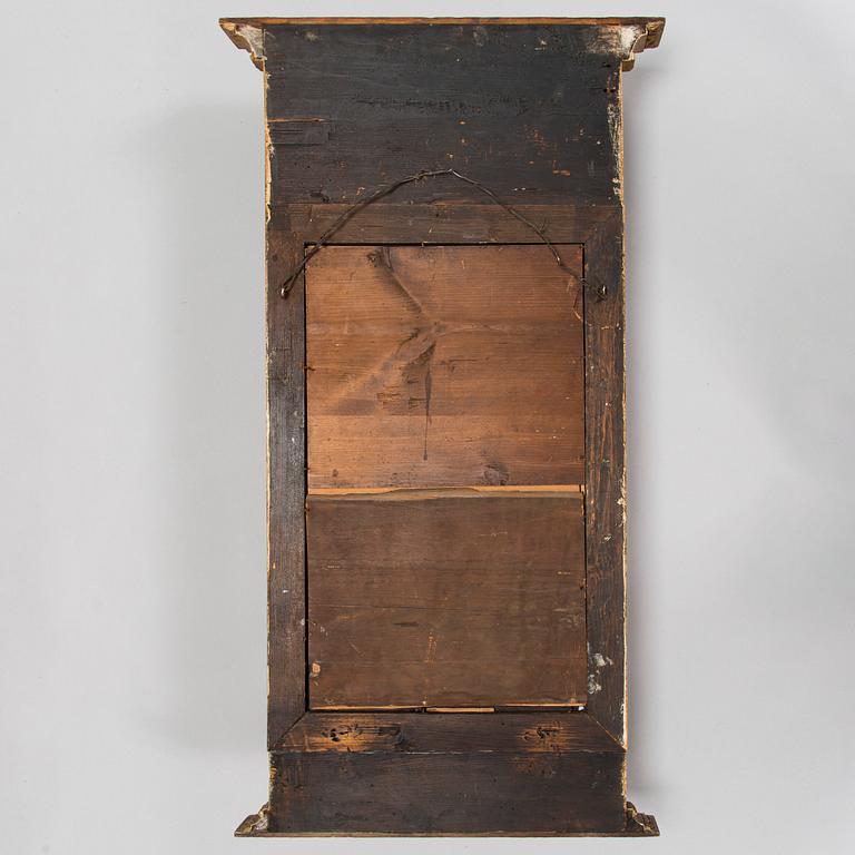 An Empire mirror, first half of the 19th century.
