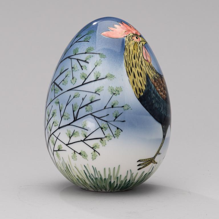 A porcelain egg signed GOG Arabia Finland.