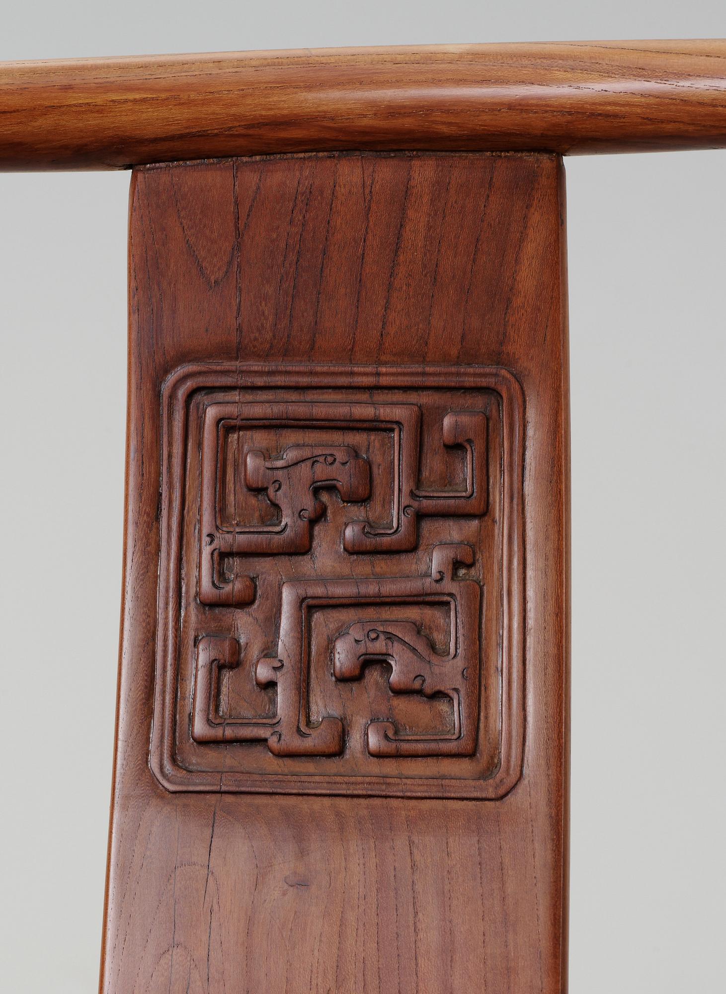 A pair of hardwood armchairs, Qing dynasty.