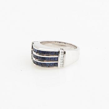 Ring, 18K white gold with baguette-cut diamonds and princess-cut sapphires.