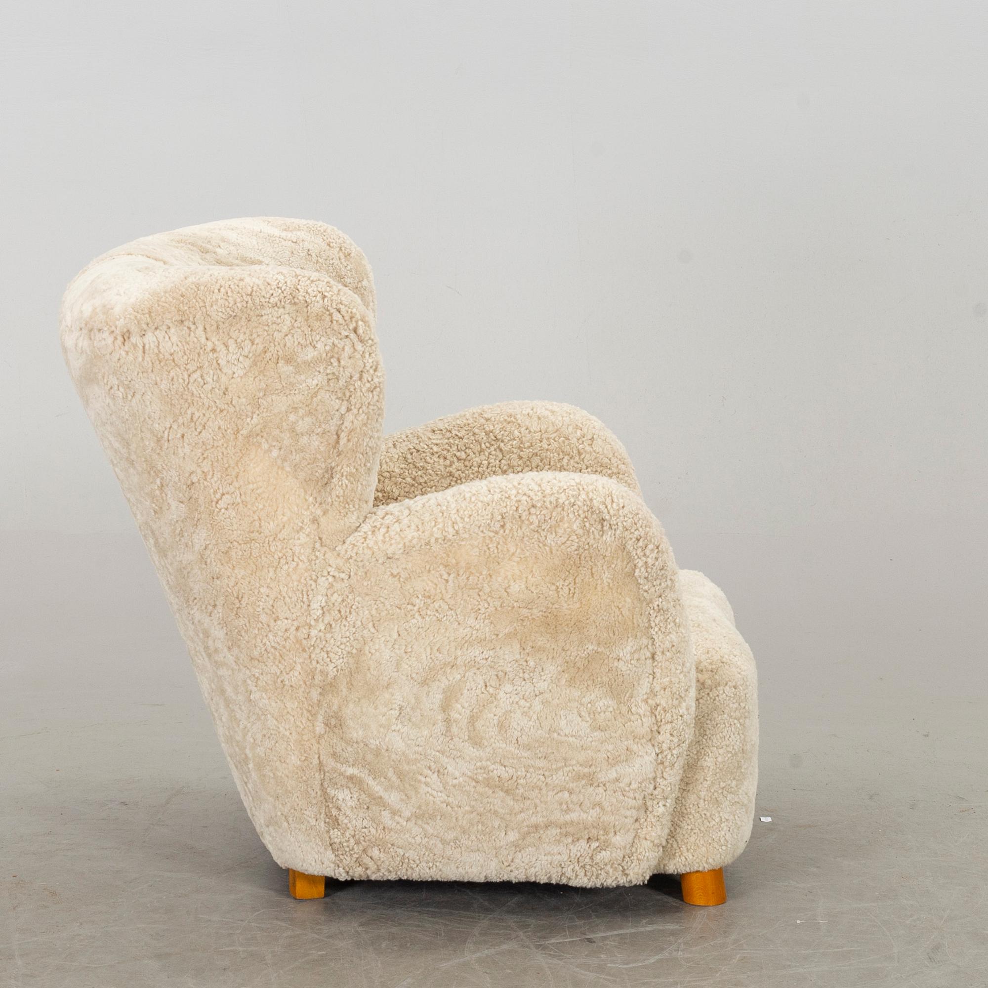 A DANISH SHEEPSKIN ARMCHAIR, 1940-50's.