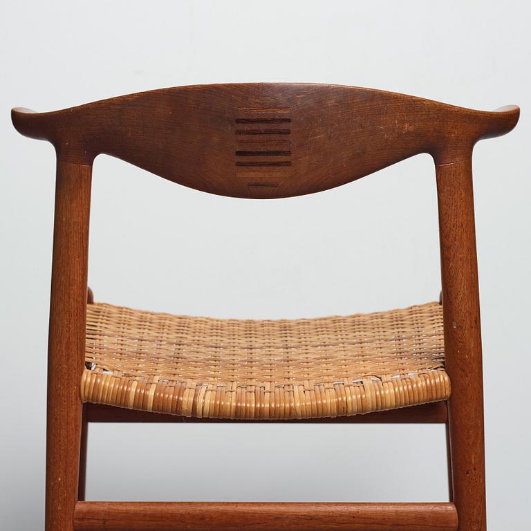 Hans J. Wegner, a set of six teak and rattan "Cowhorn Chairs" "JH-505", executed by cabinetmaker Johannes Hansen, Denmark 1950-60's.