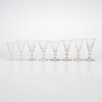 A set of 19 similar drinking glasses from the turn of the 19th/20th century.