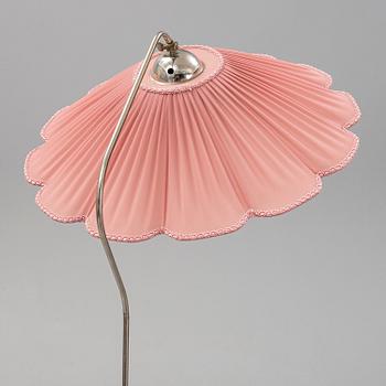 A 1940s birch wood floor lamp.