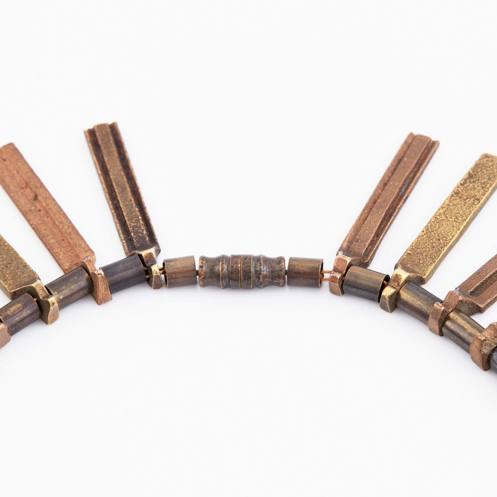 Inga-Britt "Ibe" Dahlquist, a bronze necklace "Nefertiti".