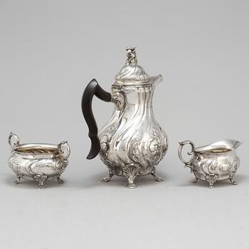 A three-piece silver rococo style coffee service by CG Hallberg, Stockholm, 1948.