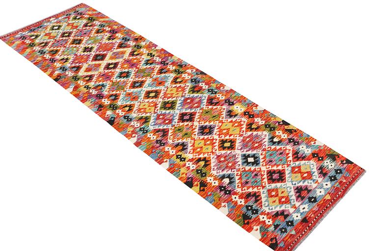 A Kilim runner carpet, c. 298 x 80 cm.