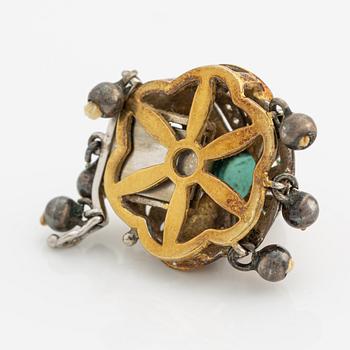 A clasp for a three strand necklace.