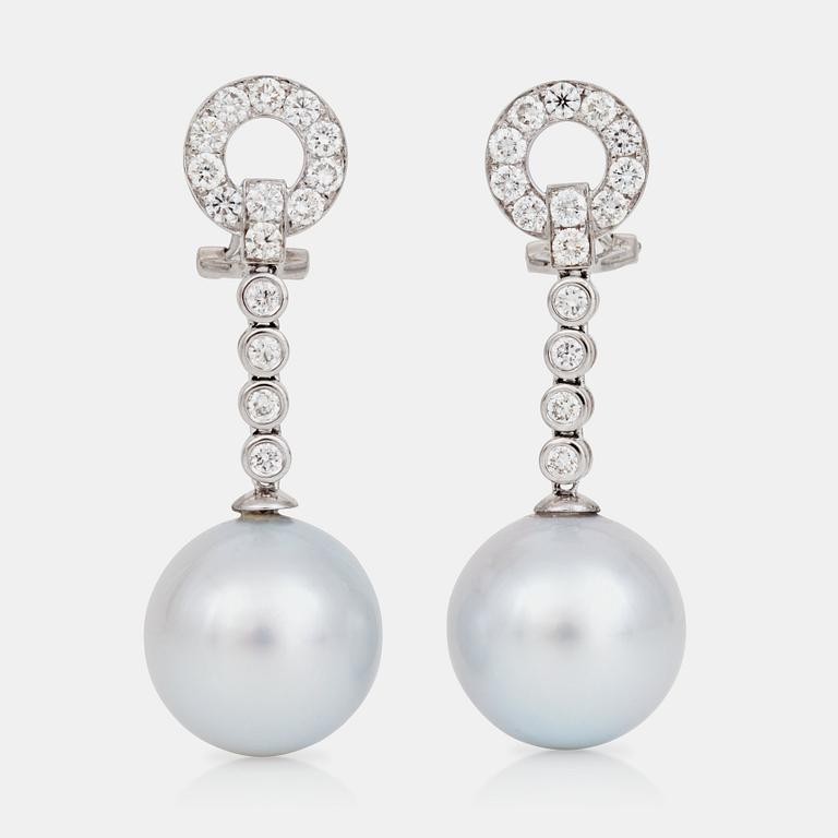 A pair of culltured South Sea pearl and brilliant-cut diamond earrings.