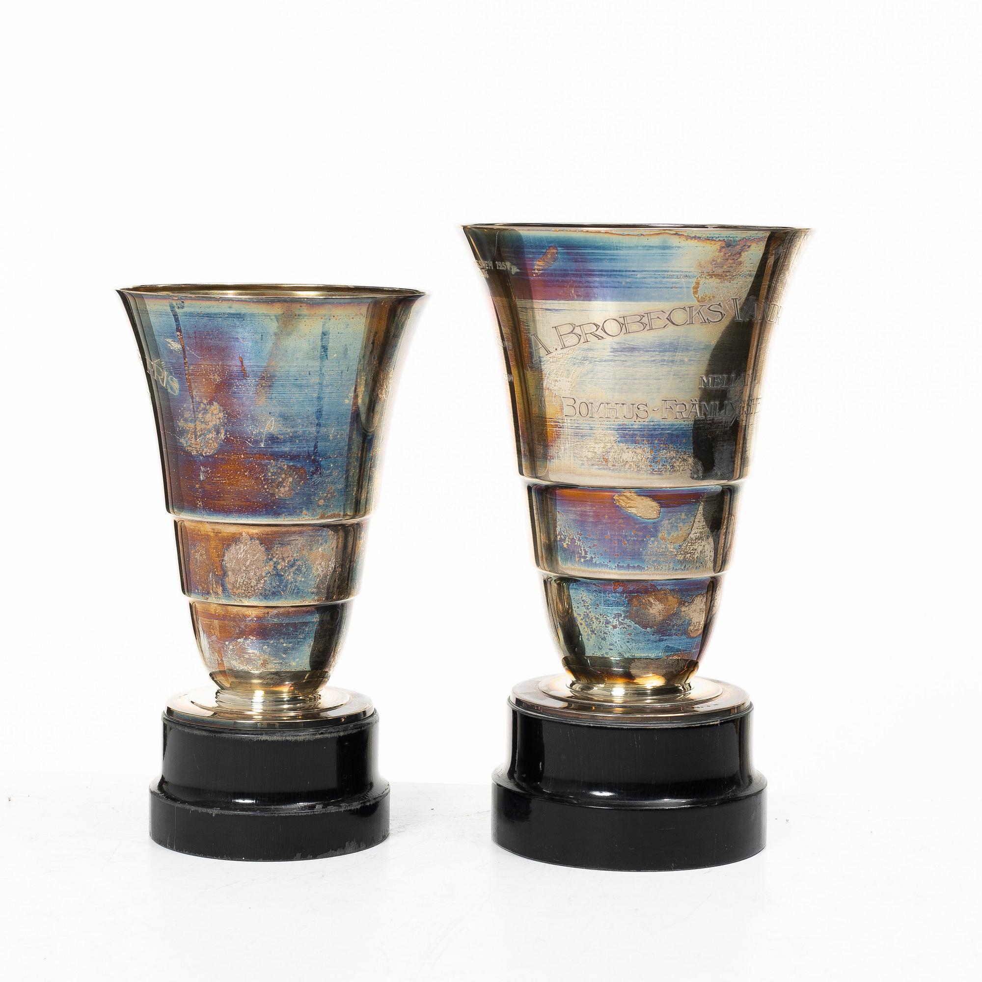 Guldsmedsaktiebolaget (GAB), Two silver vases on wooden bases, Stockholm 1931-1933.