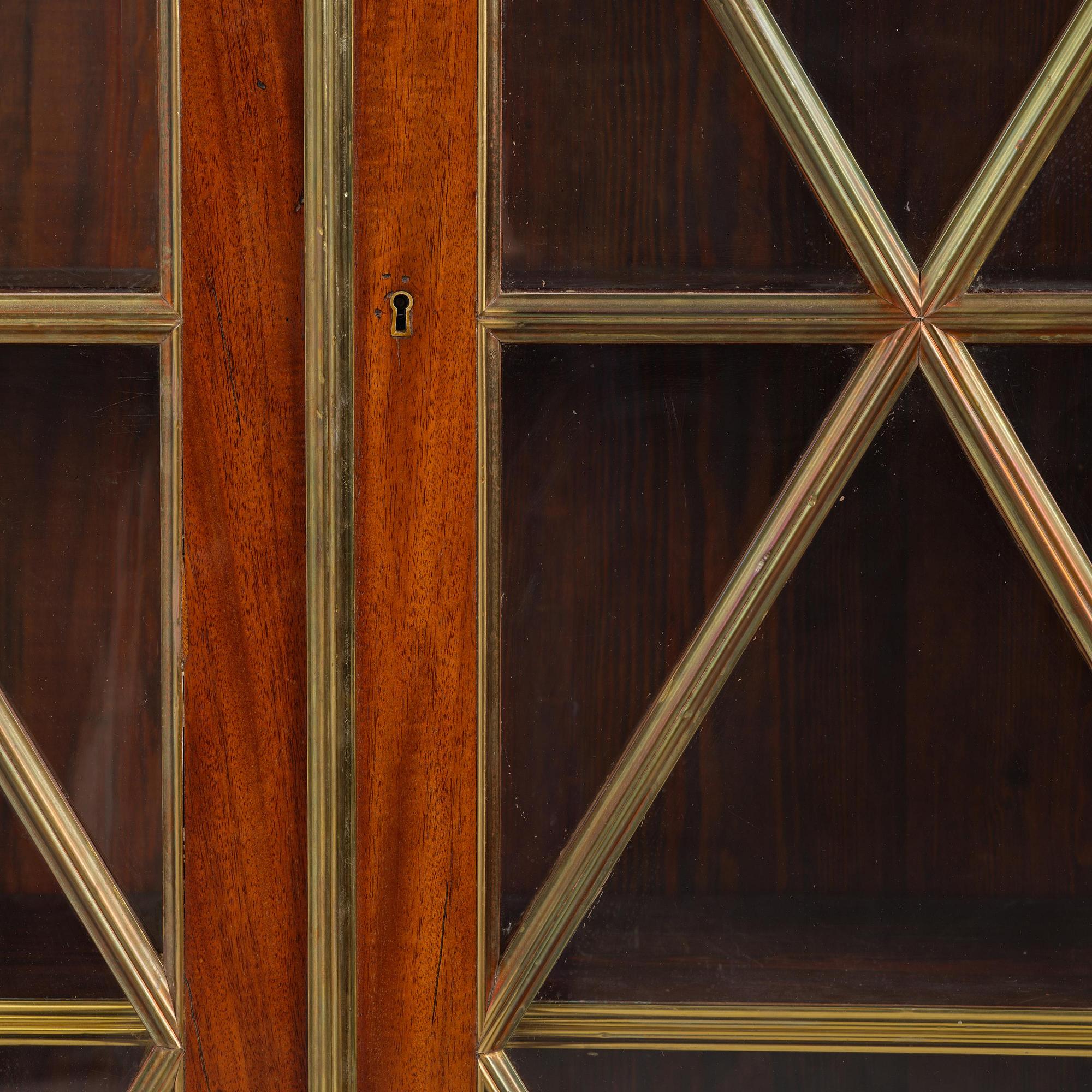 A pair of Russian mahogany and brass-mounted Jacob-style bibliothèques, modern with old parts.