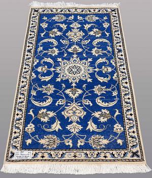 Two Nain rugs 140 x 69 and 134 x 69 cm.