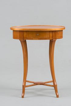 A OVAL SHAPED EMPIRE TABLE.