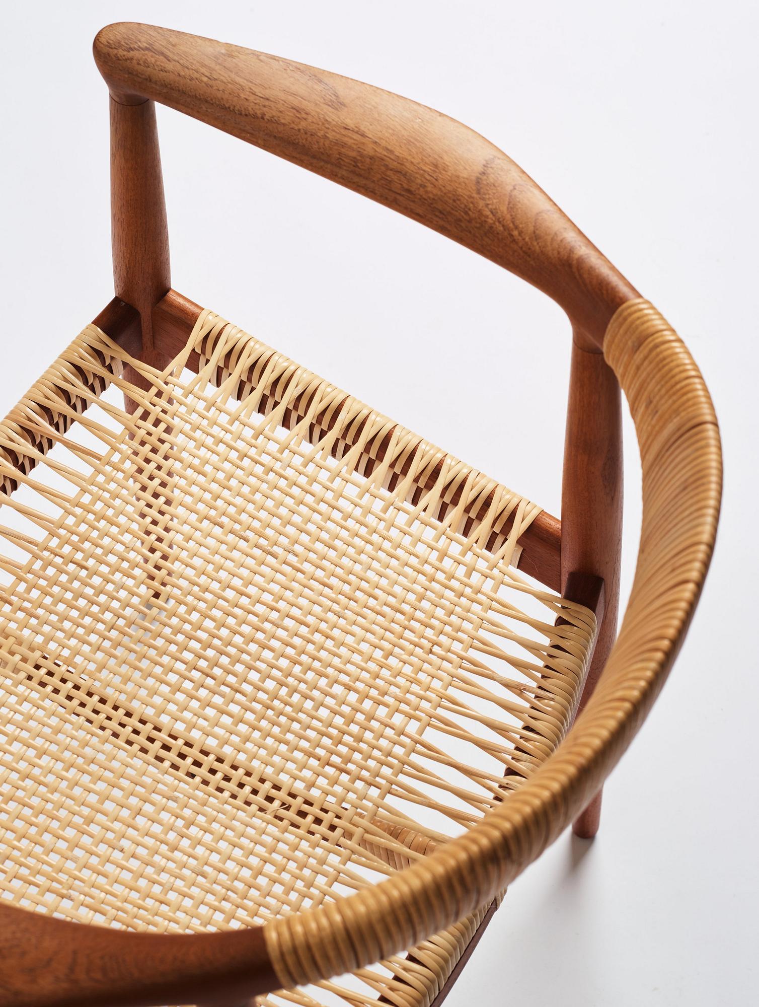 Hans J. Wegner, a pair of teak and rattan 'The Chair', JH-503, Johannes Hansen, Denmark 1950s.