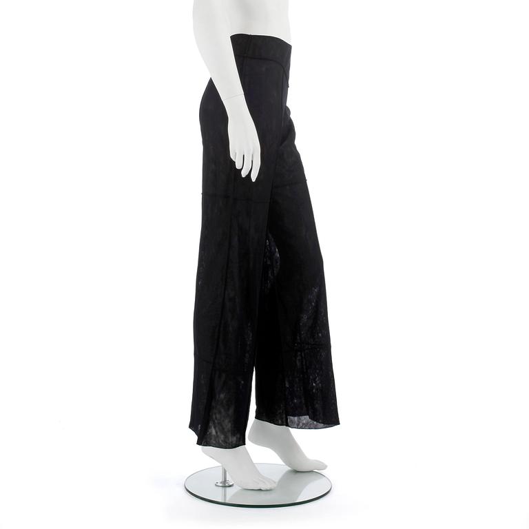 CHANEL, a black mesh evening pant.