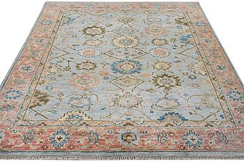 An oriental carpet with Mamluk design, c. 302 x 252 cm.