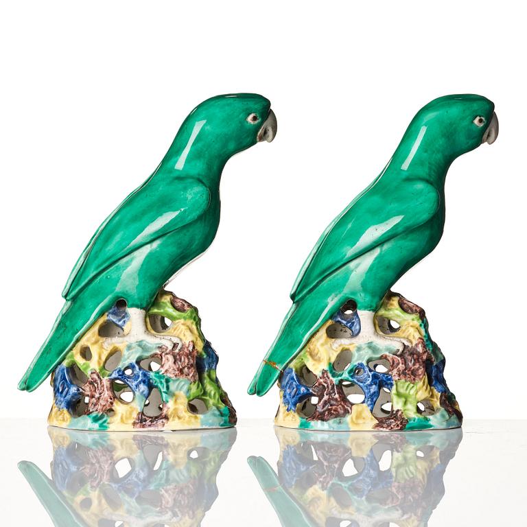 A pair of green glazed parrots, late Qing dynasty.