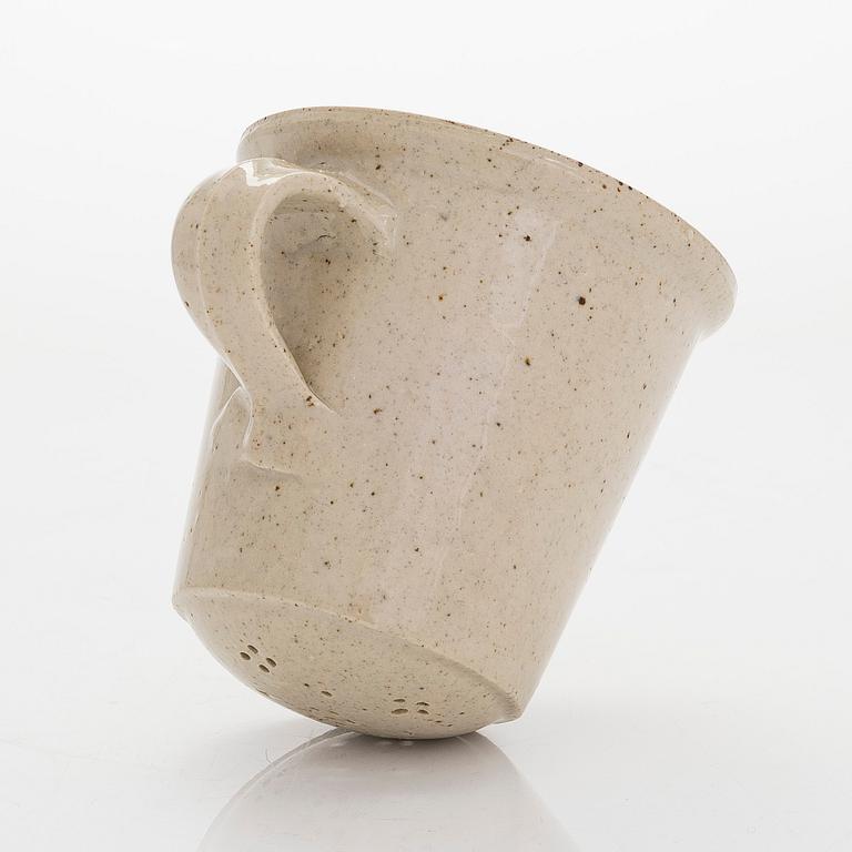 Kyllikki Salmenhaara, a stoneware tea strainer signed KS.