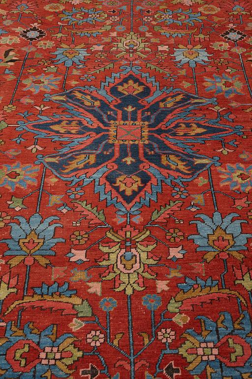 A carpet, an antique/semi-antique Heriz, ca 352 x 275 cm.