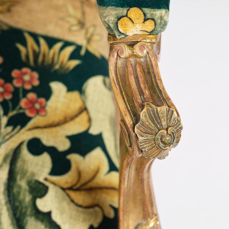 A pair of Louis XV-style giltwood fauteuils, late 19th century.