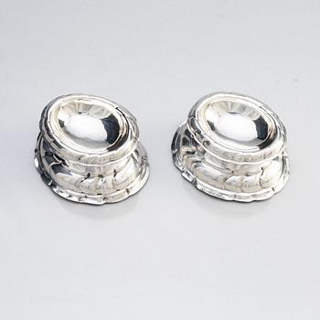 A pair of European Rococo 18th century silver salt-cellars.