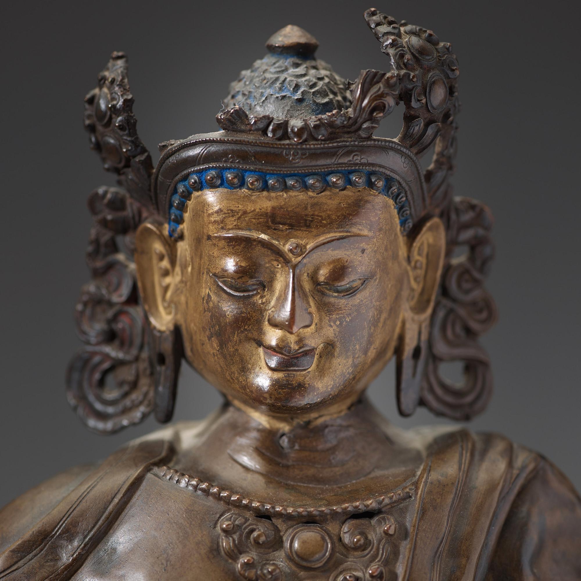 A copper alloy and gilt repoussé Bodhisattva, 17th/18th century.
