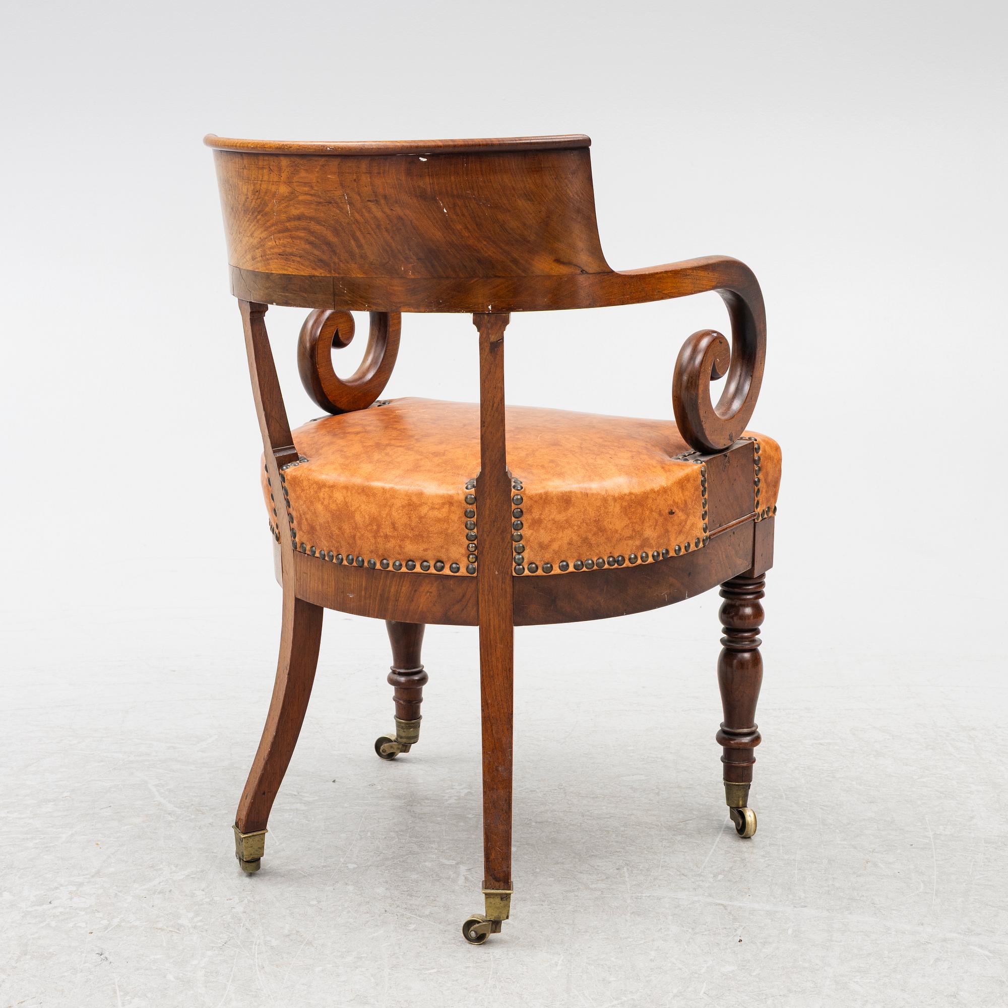 An Empire armchair, 19th century.