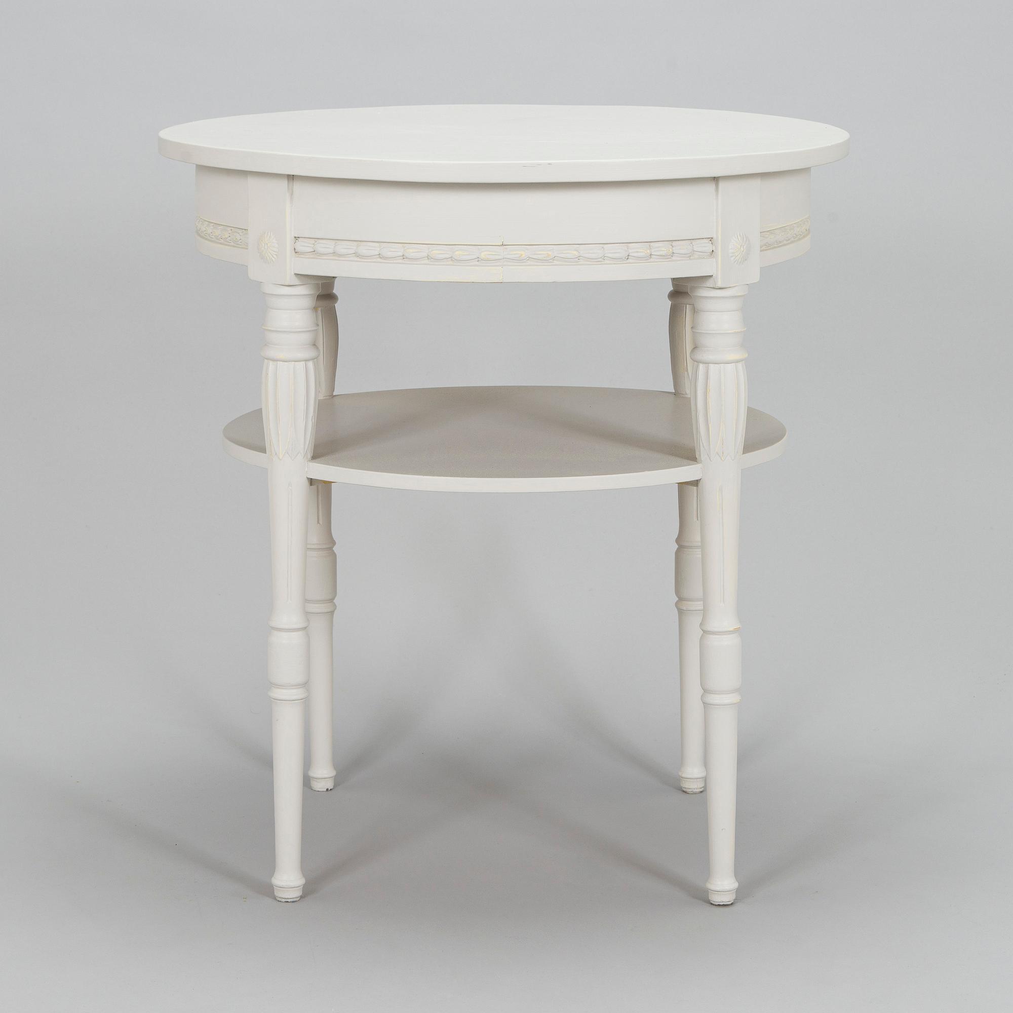 A Gustavian style small round table from first half of the 20th century.