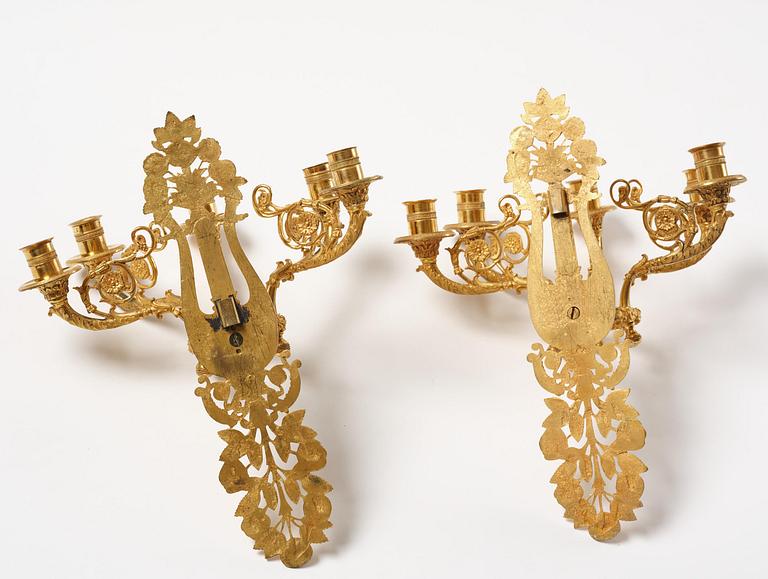 A pair of French 19th century gilt bronze five-light wall-lights.