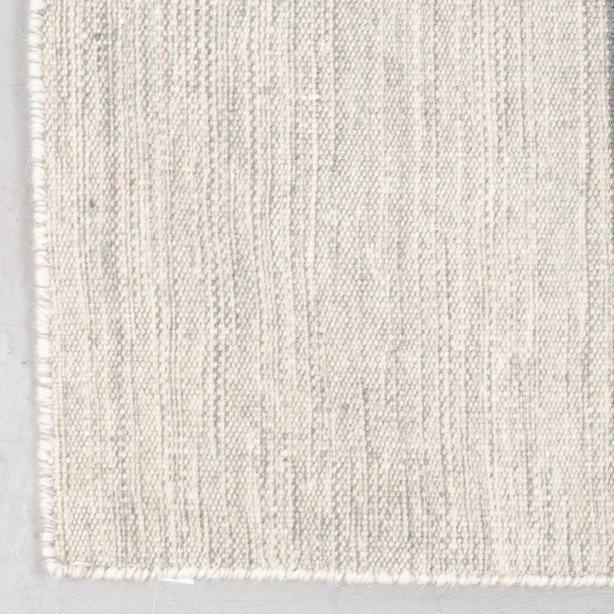 A rug, flat weave, ca 230 x 160 cm.