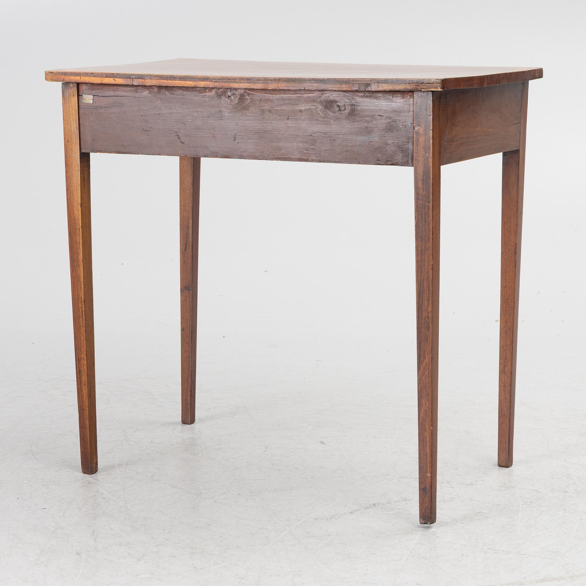 A table, England, circa 1900.