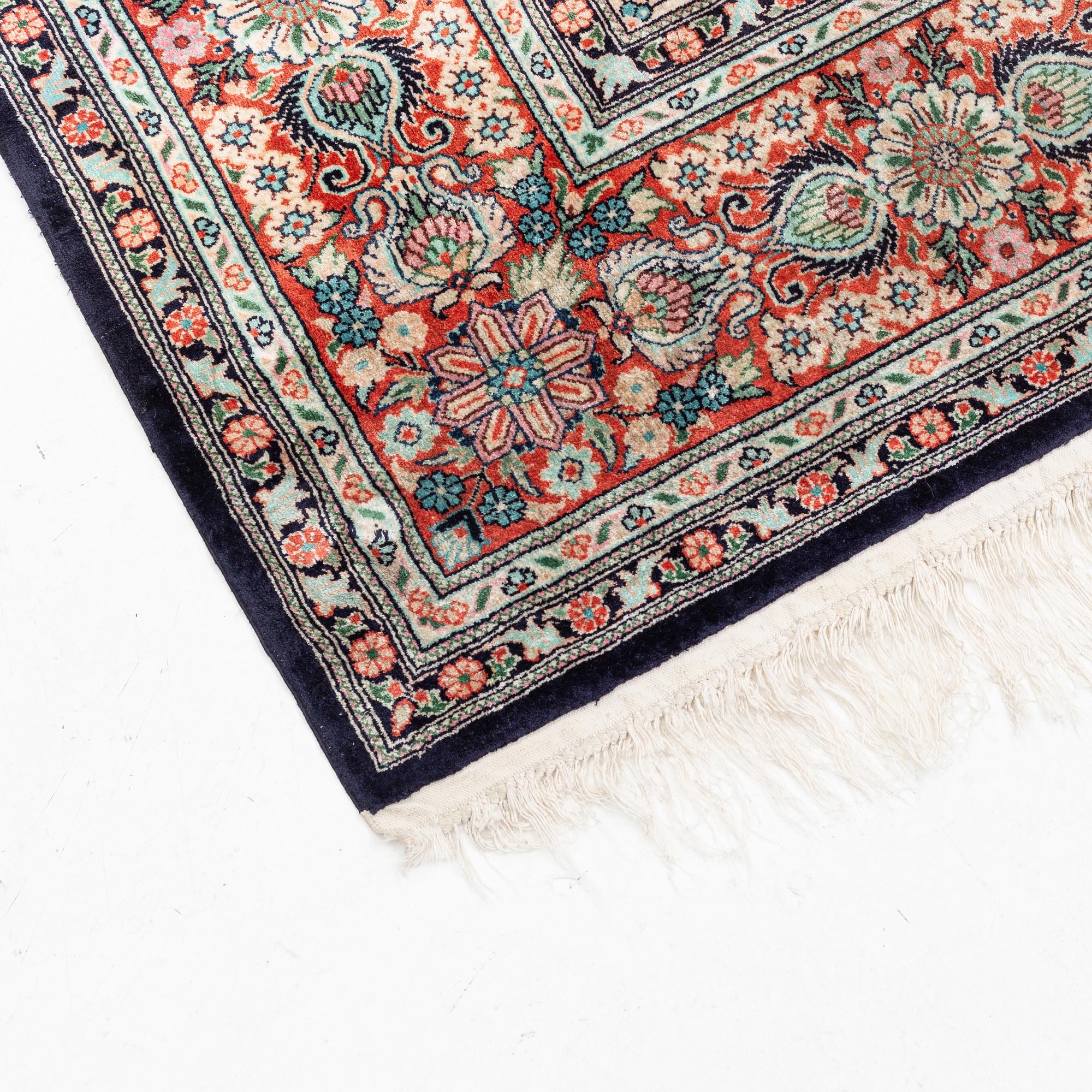 An oriental carpet, mercerized cotton, c. 275 x 182 cm.