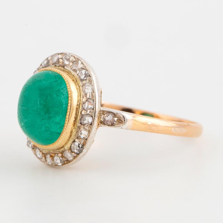 Cabochon-cut emerald and rose-cut diamond cluster ring.