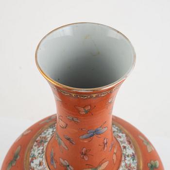 A Chinese coral read ground butterfly vase, 20th century.