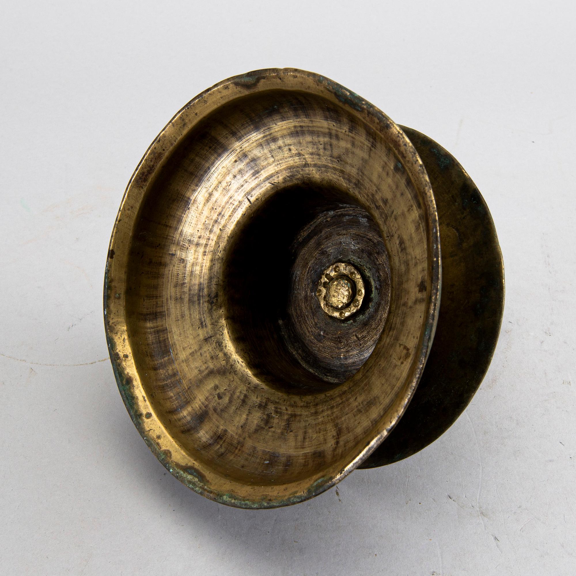 A BAROQUE BRASS CANDLESTICK, 18th century.