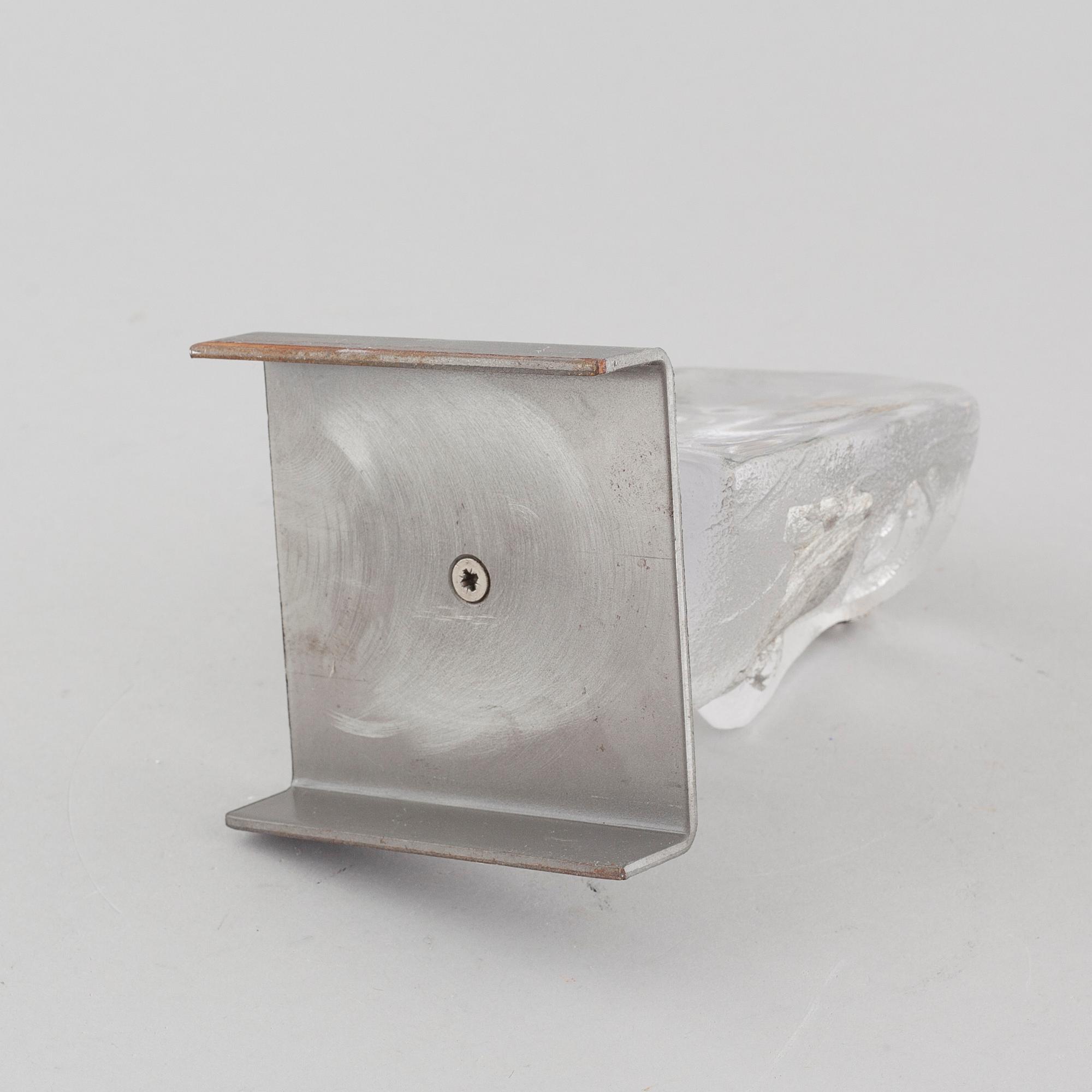 a glass object, signed.