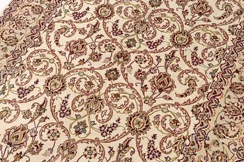 An Isfahan, part silk rug, signed, c. 165 x 112 cm.