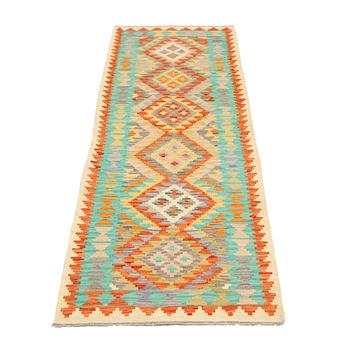 A kilim runner, c 300 x 85 cm.