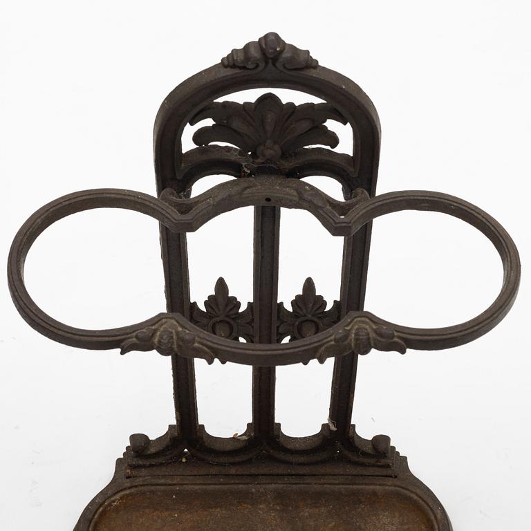 A cast iron umbrella stand, circa 1900.
