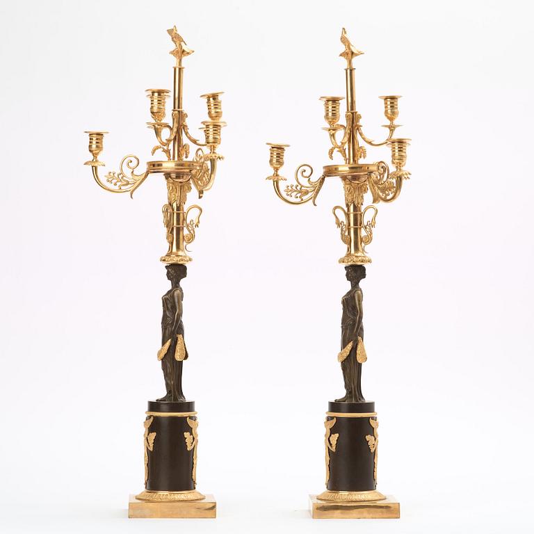 A pair of Empire early 19th century six-light candelabra.