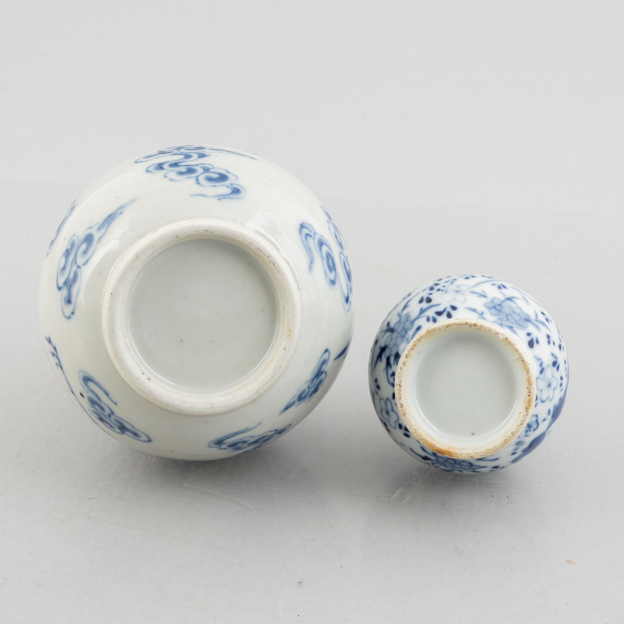 Two blue and white vases and two white glazed cups, China, late Qing dynasty and early 20th century.